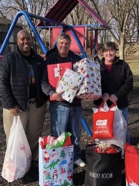 Michael Johnson with Mike and Kathleen Liautaud